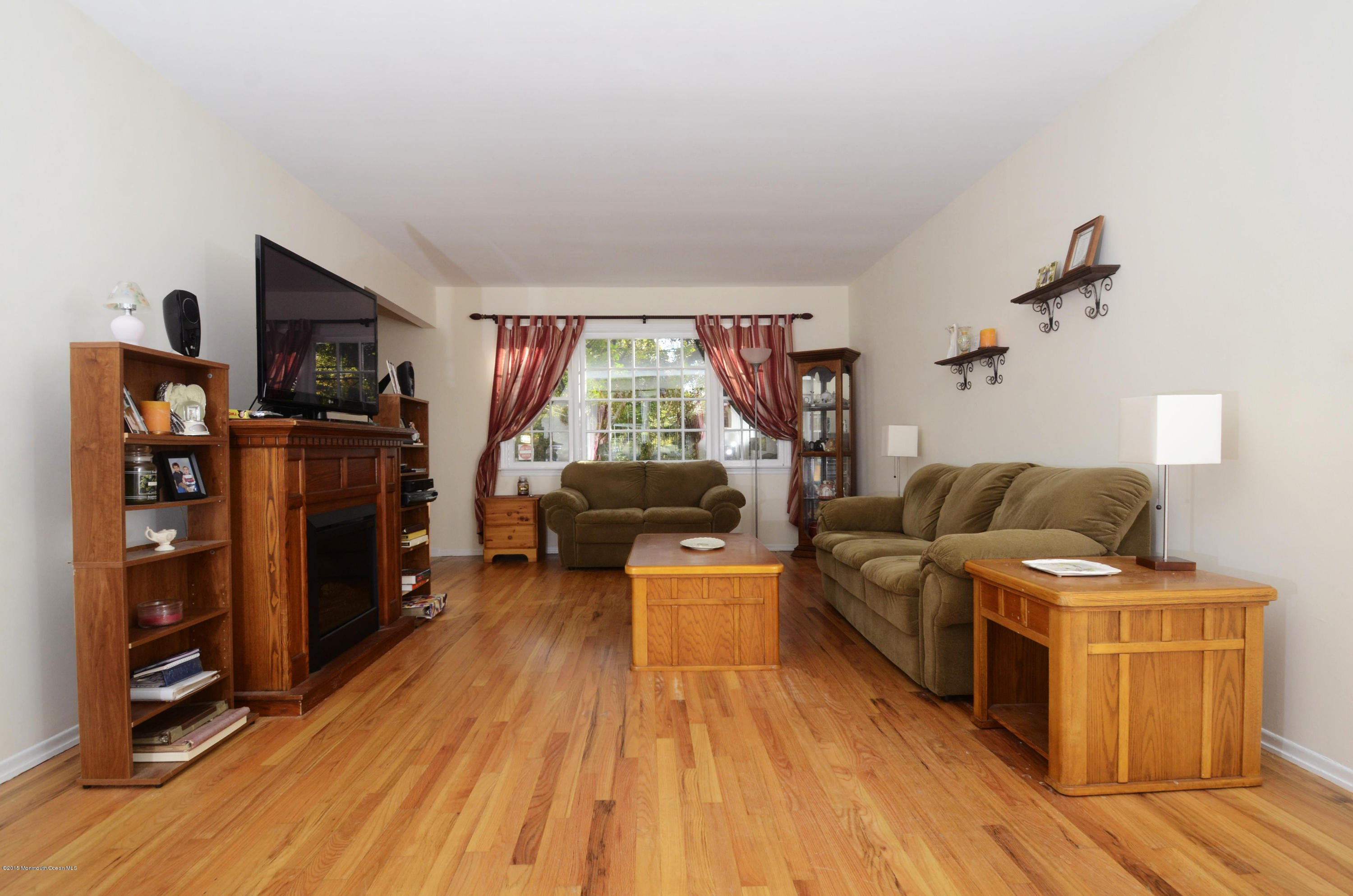 57 Middlesex Road Matawan, NJ 07747 - Photo 2 of 23 a living room with furniture and a flat screen tv