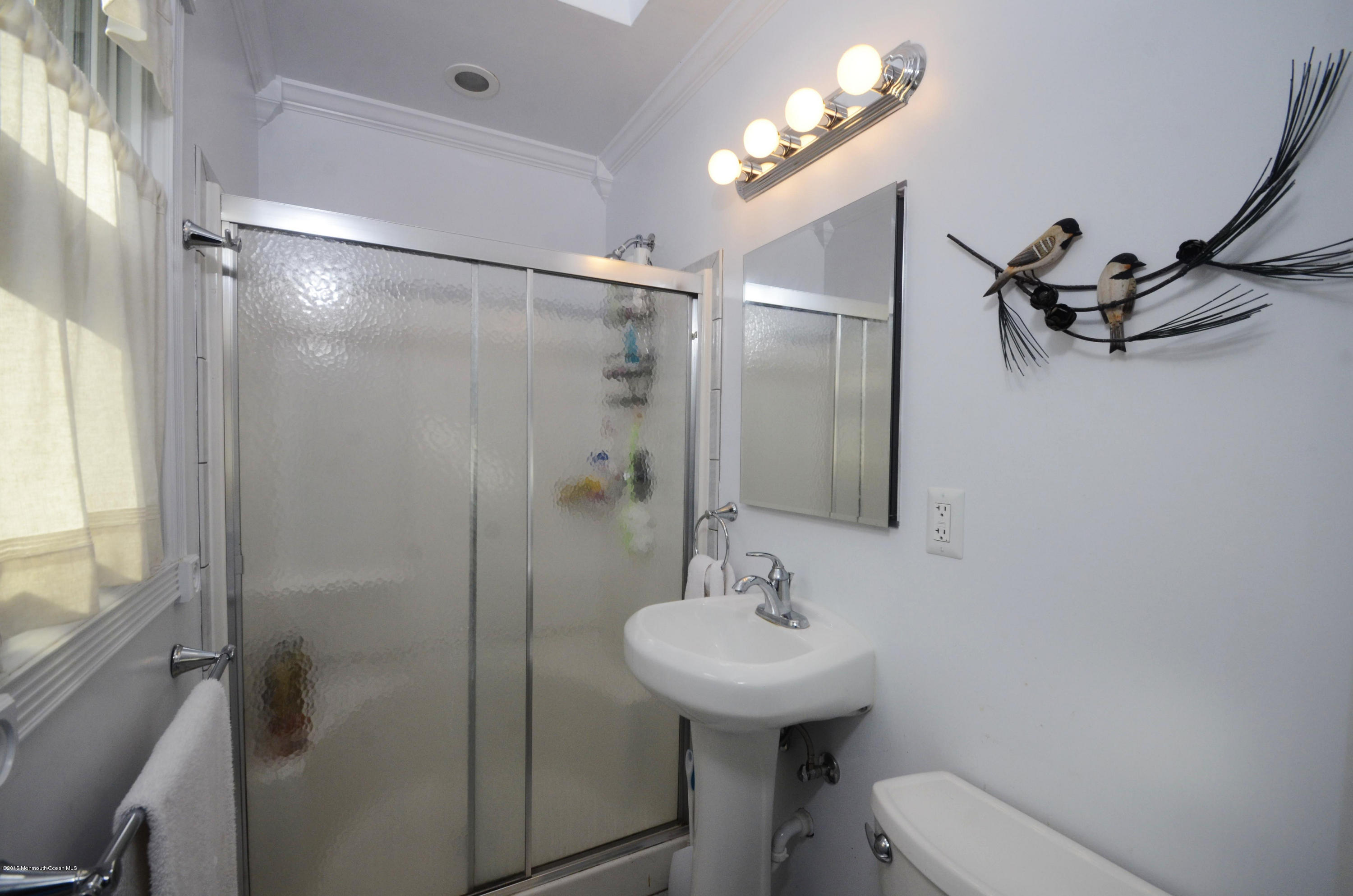 57 Middlesex Road Matawan, NJ 07747 - Photo 13 of 23 a bathroom with a sink toilet and shower