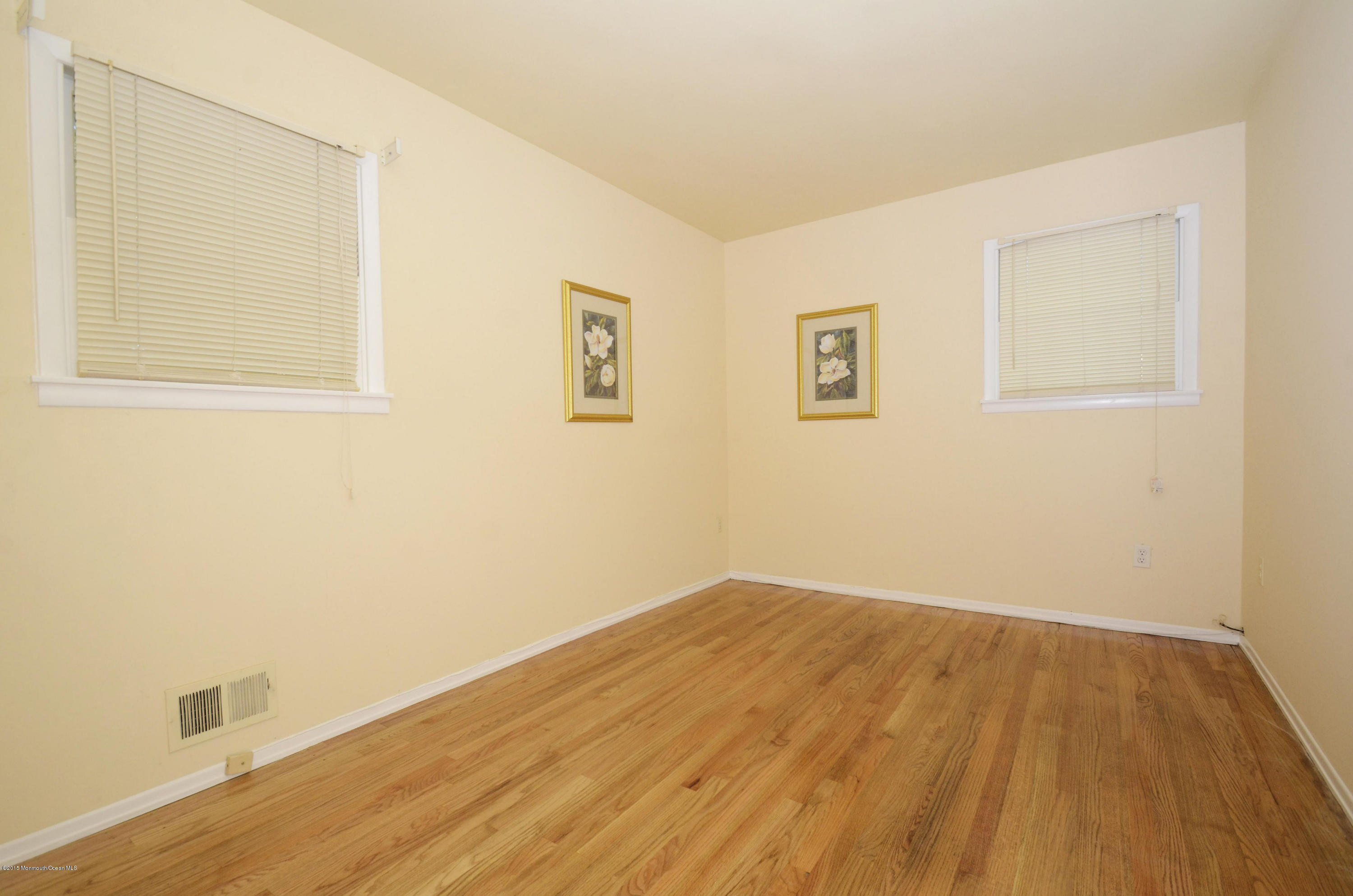 57 Middlesex Road Matawan, NJ 07747 - Photo 14 of 23 a view of empty room with wooden floor and fan