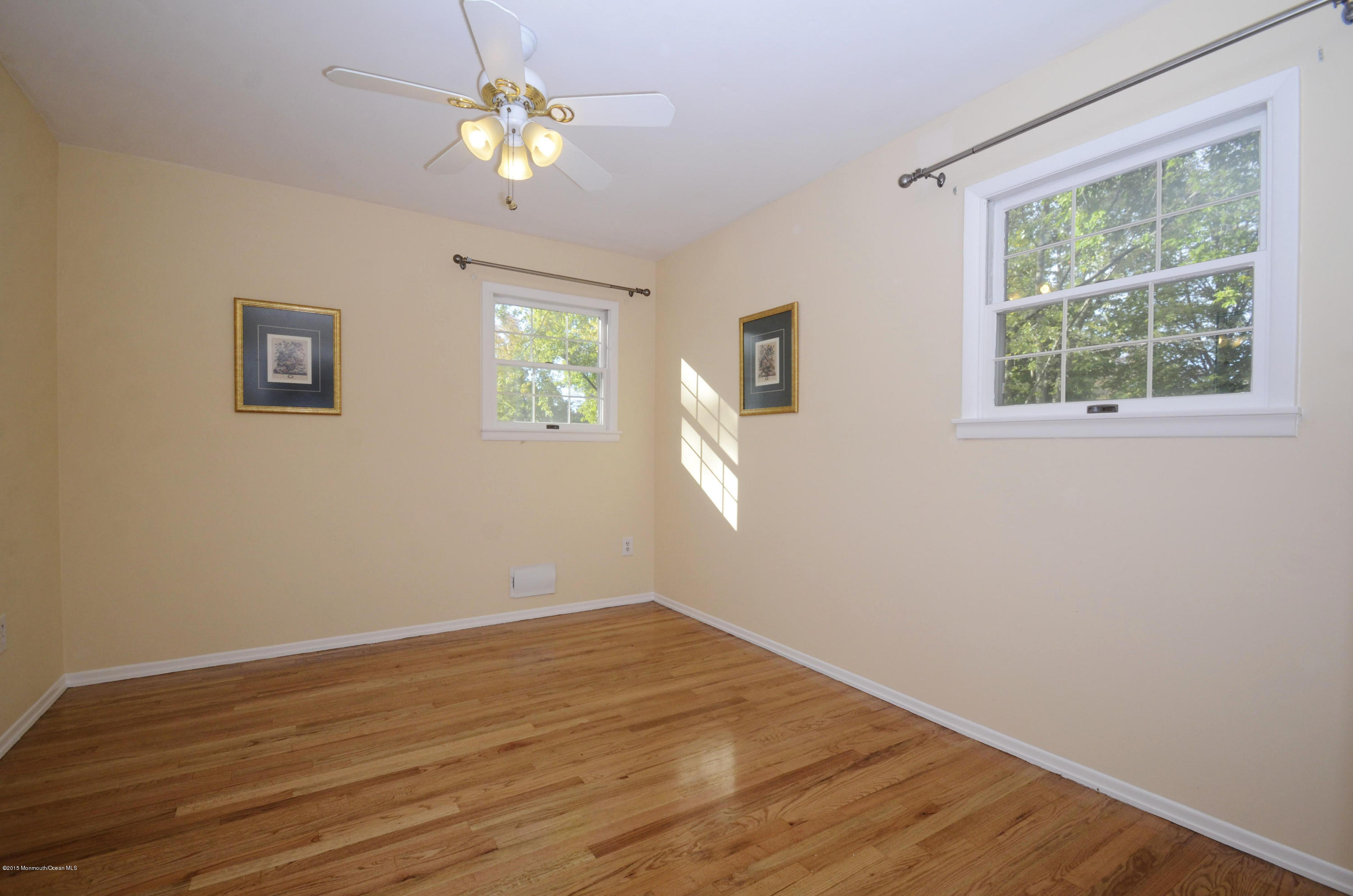 57 Middlesex Road Matawan, NJ 07747 - Photo 15 of 23 a view of empty room with wooden floor and fan