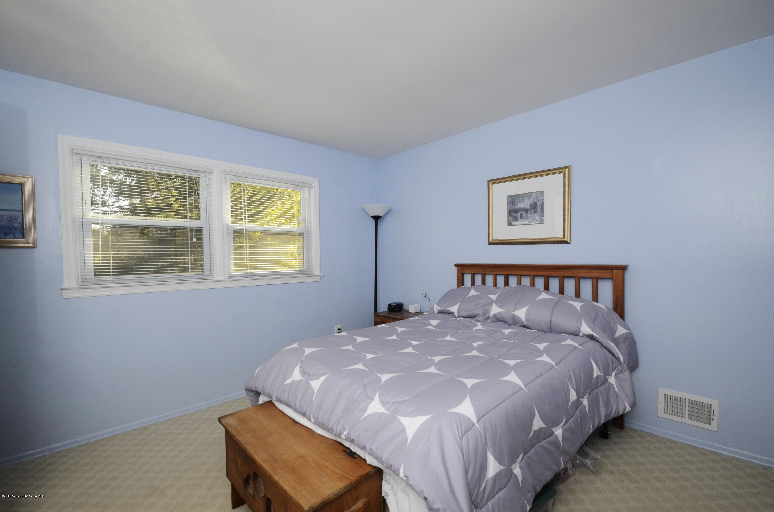 57 Middlesex Road Matawan, NJ 07747 - Photo 18 of 23 a large bed in a bedroom next to a window
