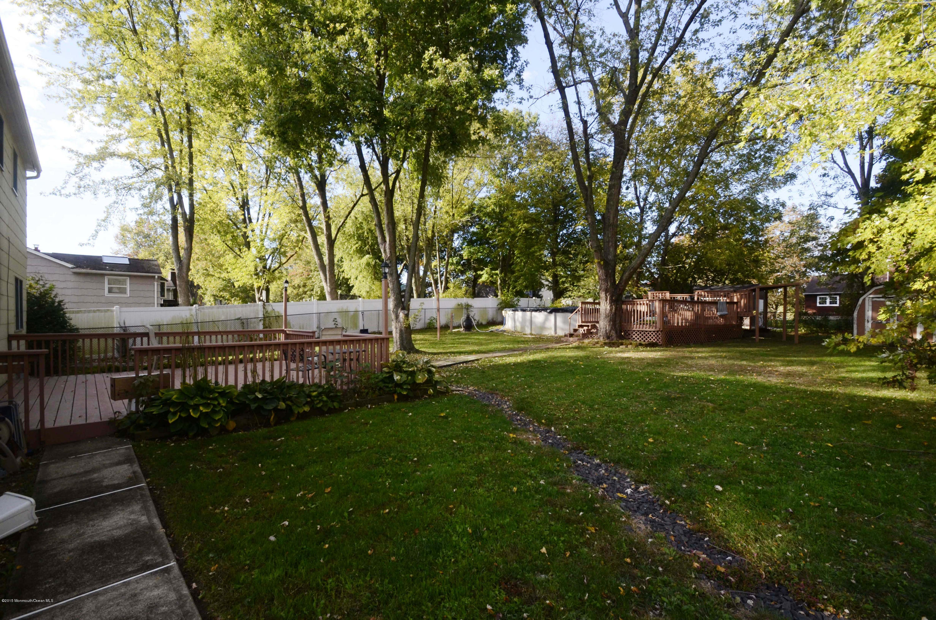 57 Middlesex Road Matawan, NJ 07747 - Photo 19 of 23 a view of yard with green space and trees