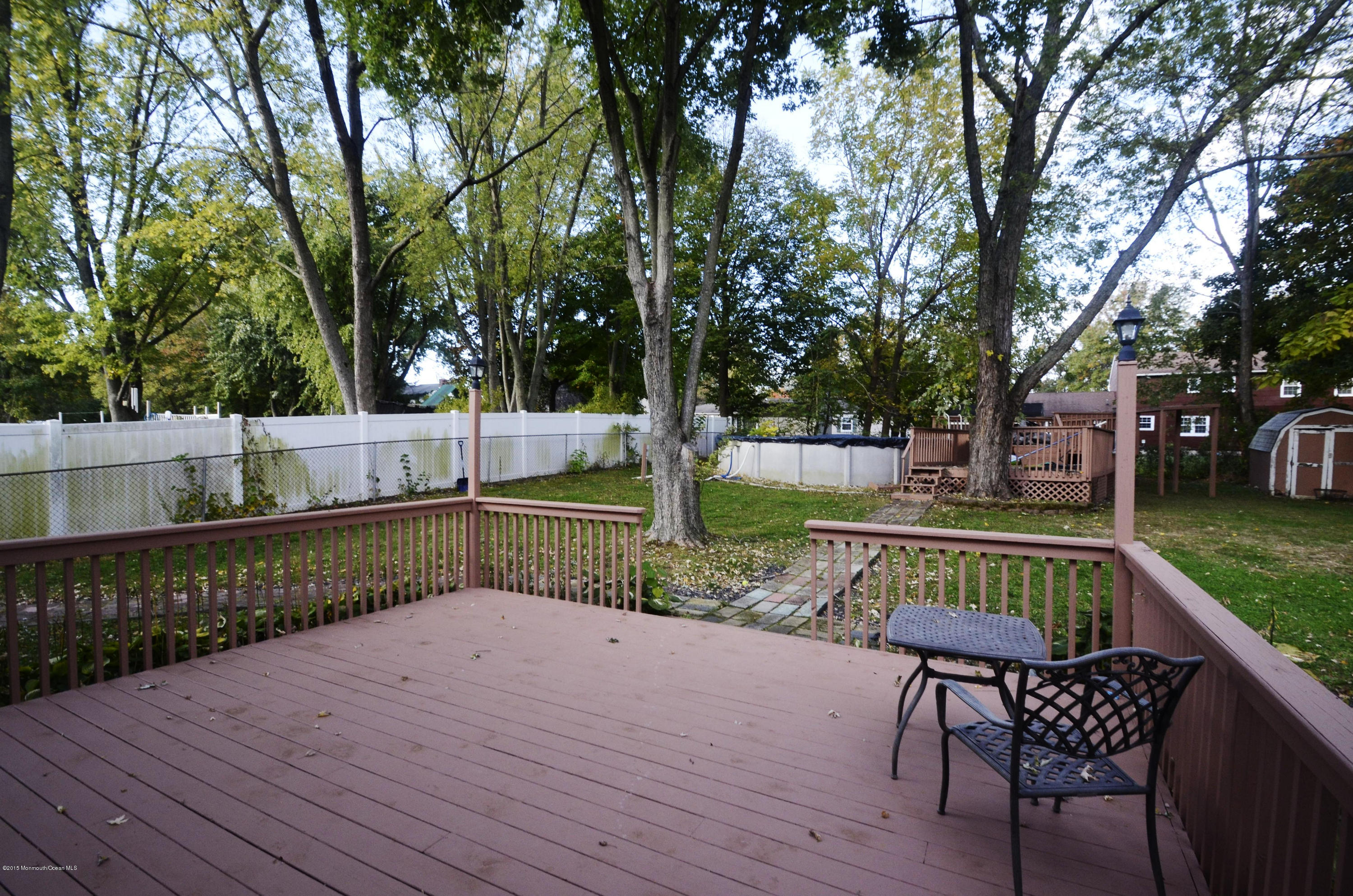 57 Middlesex Road Matawan, NJ 07747 - Photo 21 of 23 a view of backyard with deck and outdoor seating