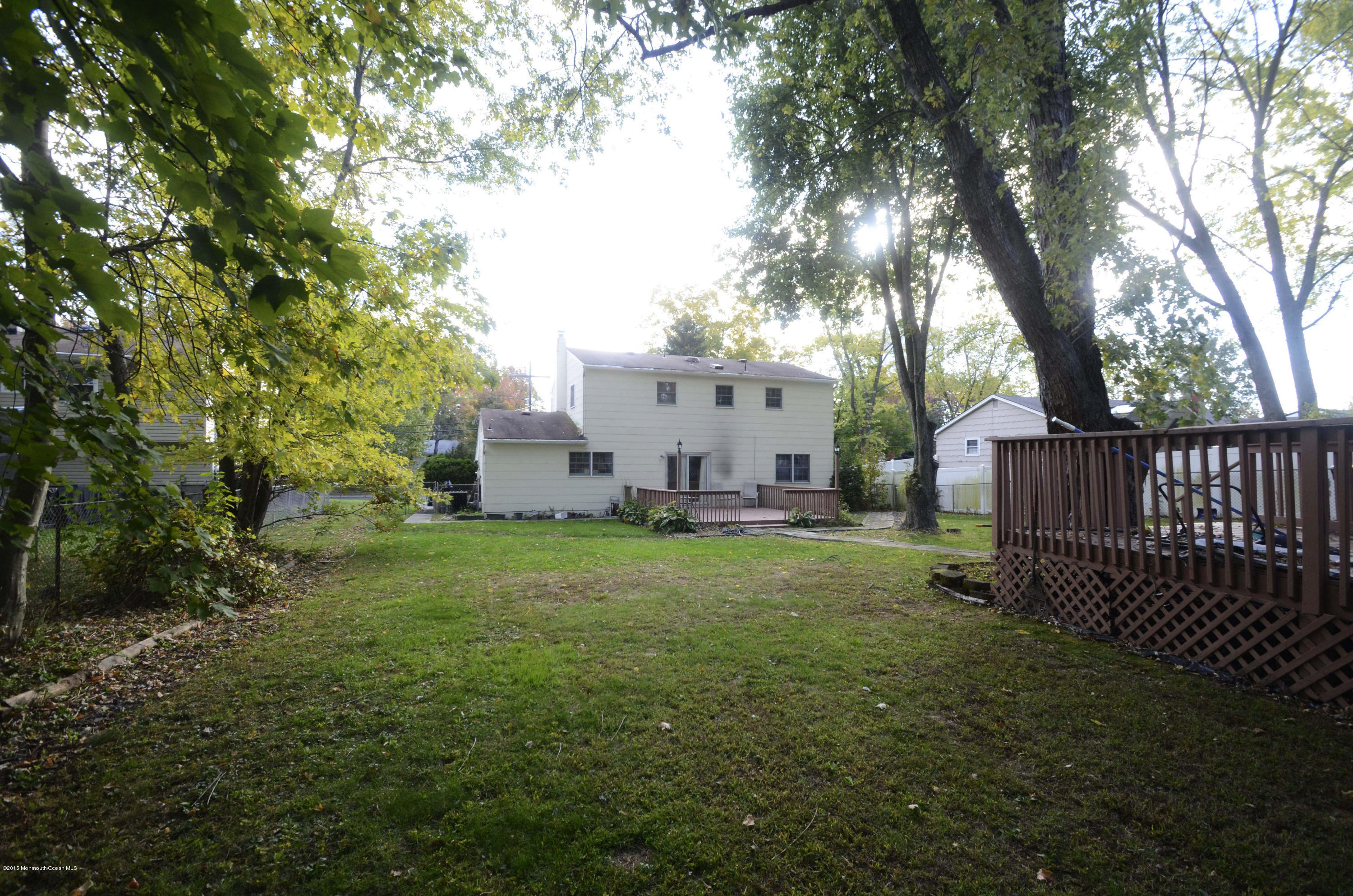 57 Middlesex Road Matawan, NJ 07747 - Photo 22 of 23 a view of a house with a yard and a large tree