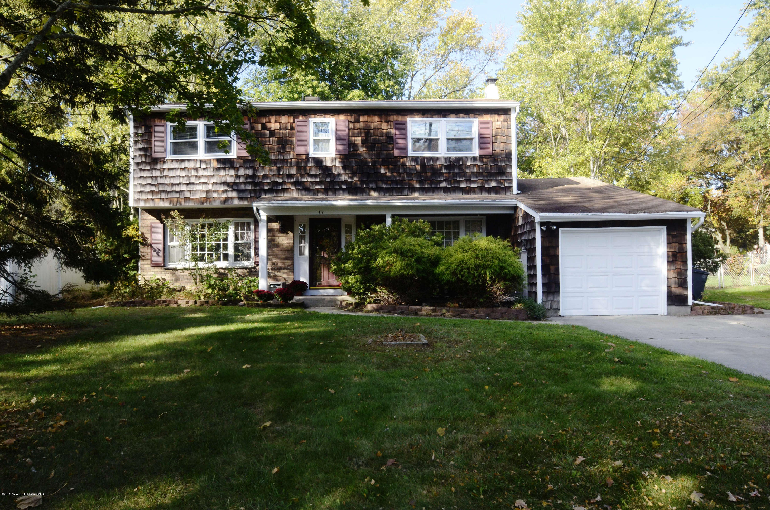 57 Middlesex Road Matawan, NJ 07747 - Photo 23 of 23 a front view of a house with a yard