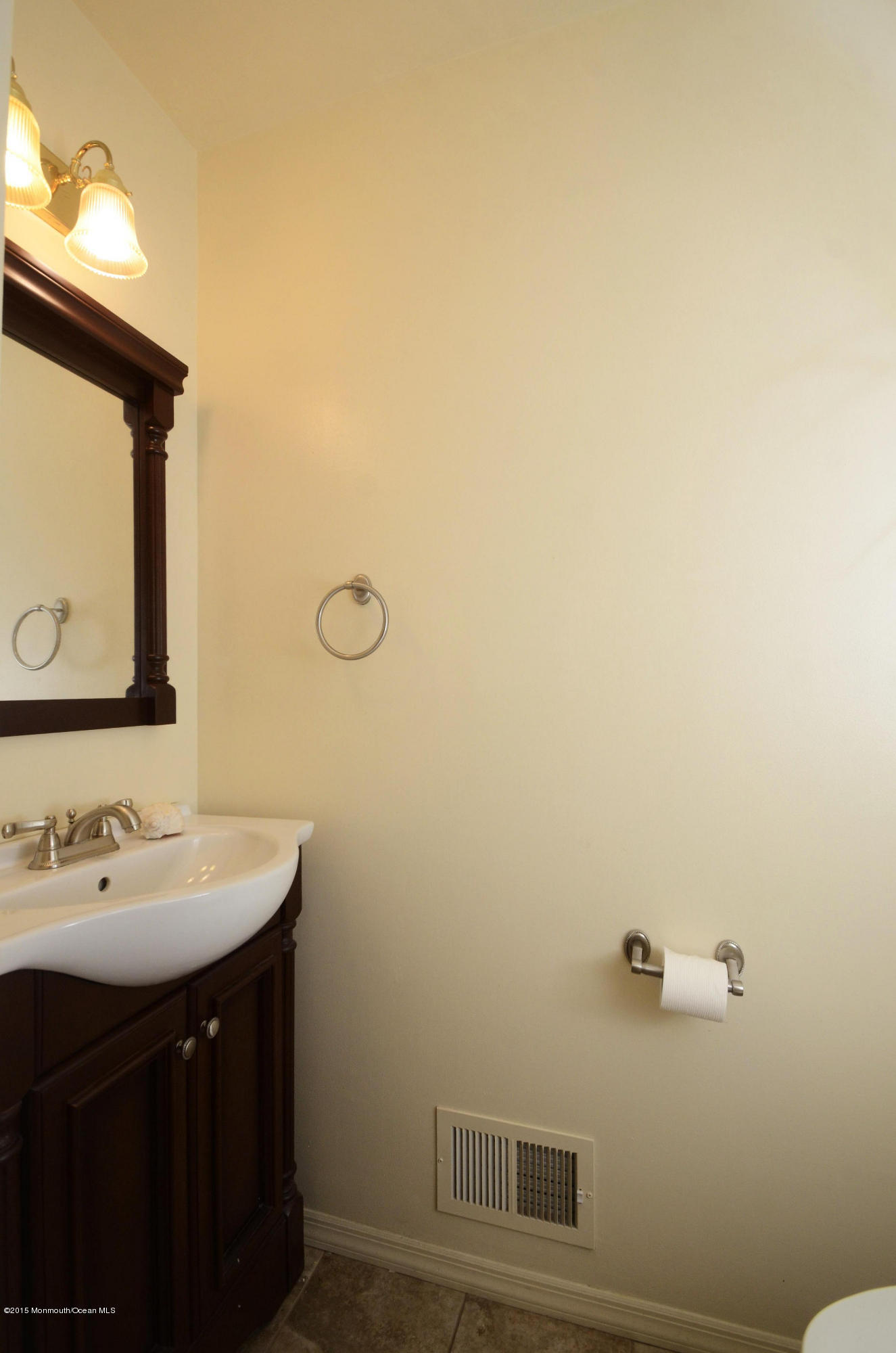 57 Middlesex Road Matawan, NJ 07747 - Photo 9 of 23 a bathroom with a sink and a mirror