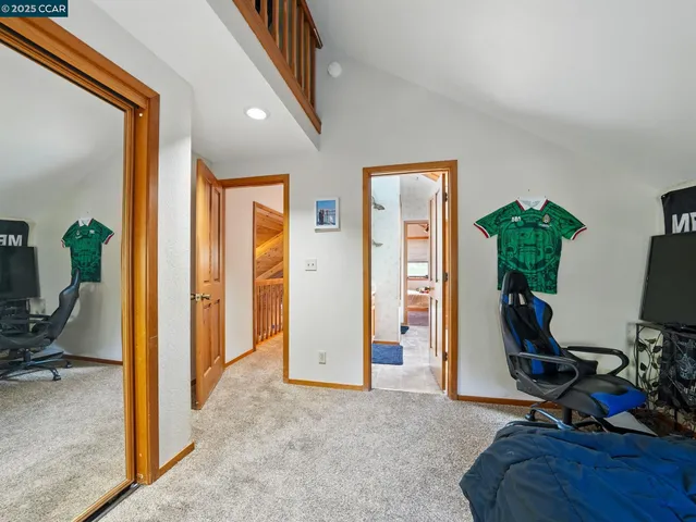 a view of a workspace with furniture and gym equipment