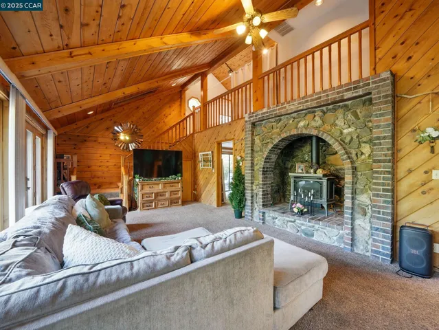 a view of living room kitchen and dining room