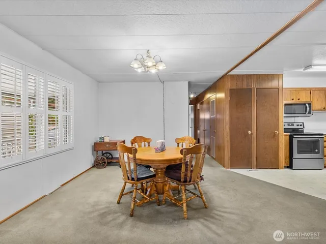 a dining room with furniture and window
