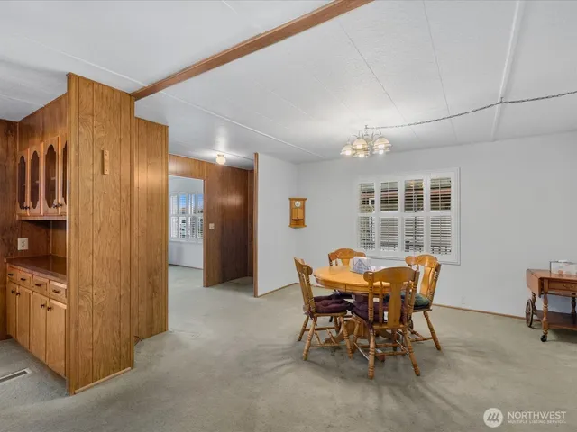 a kitchen with a sink a refrigerator and a stove