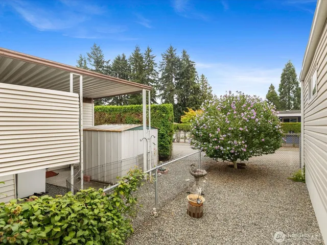 a view of a house with a flower garden