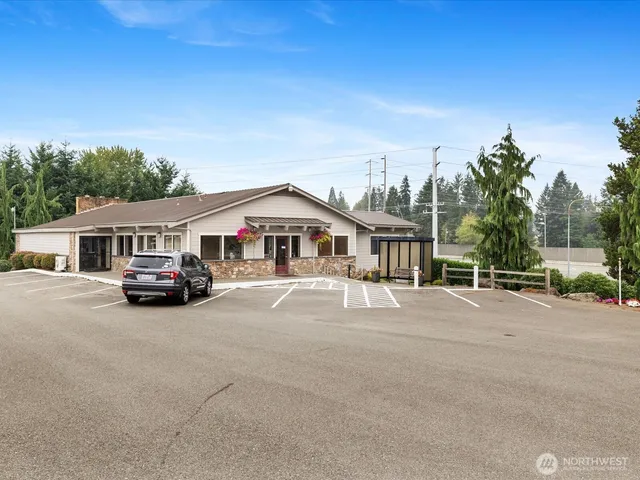a view of a swimming pool with lawn chairs