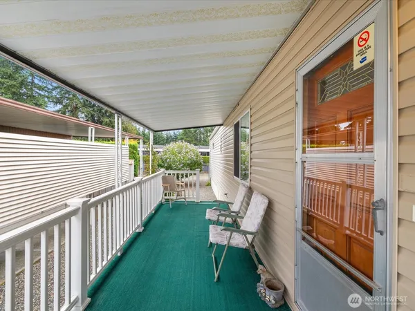 a view of a porch with furniture