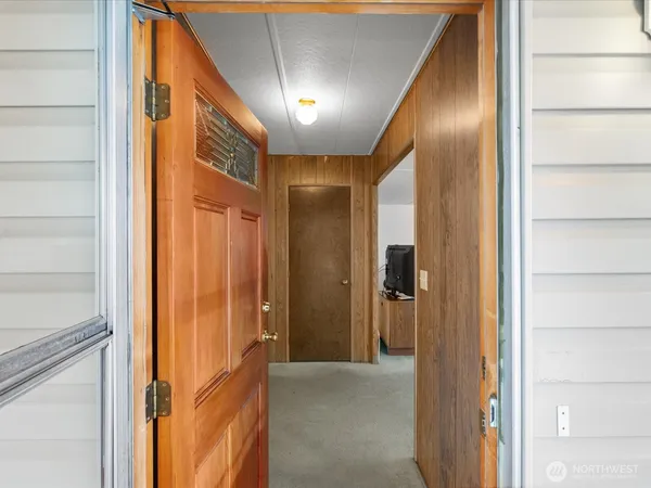 a view of a hallway and a cabinet