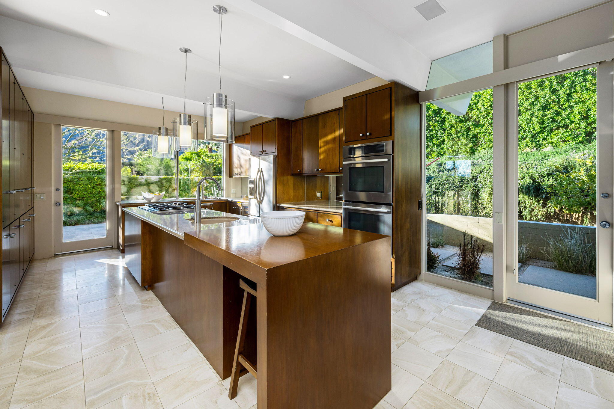40780 Thunderbird Road Rancho Mirage, CA 92270 - Photo 13 of 29 a kitchen with kitchen island a large counter top space