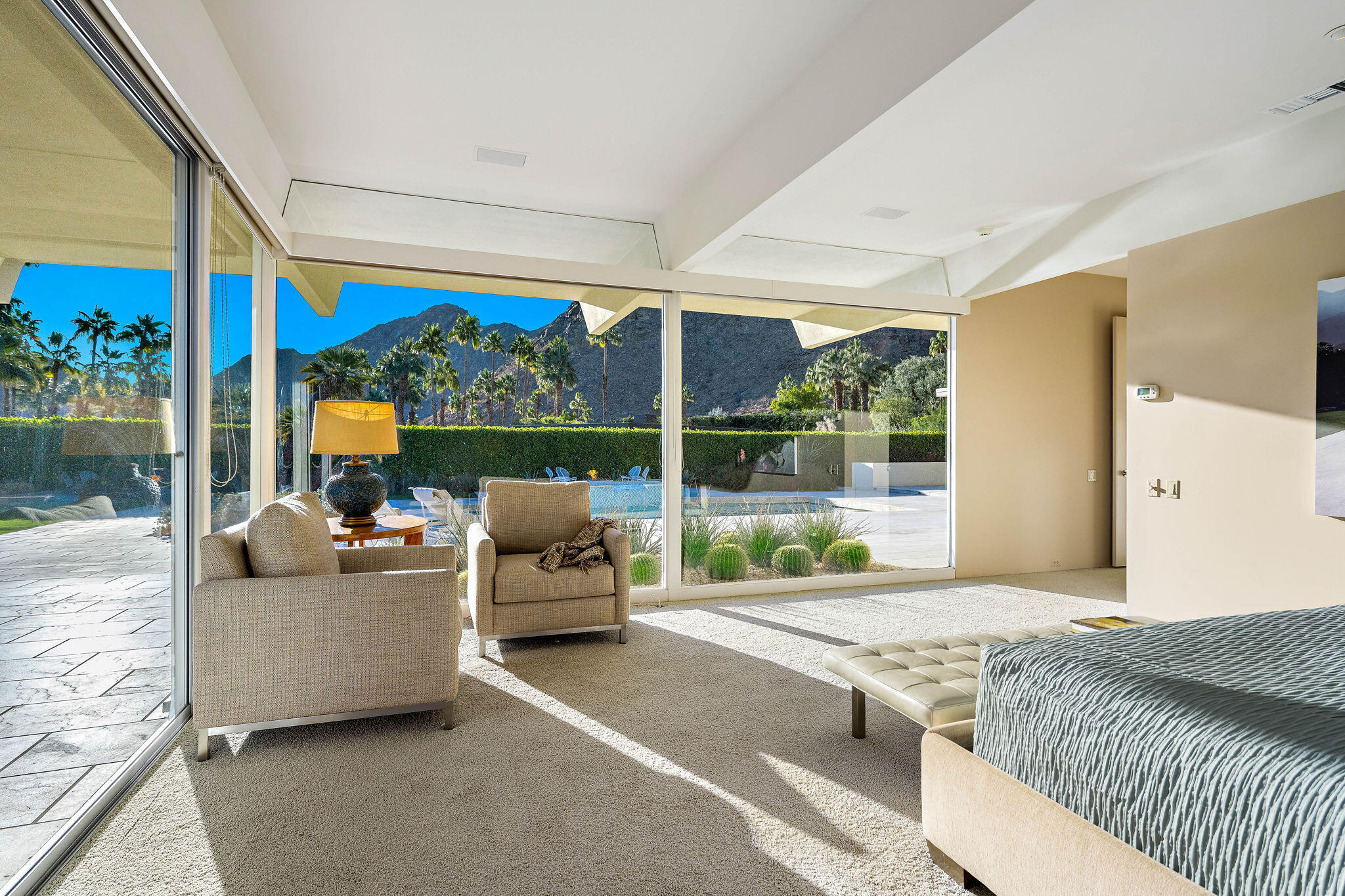 40780 Thunderbird Road Rancho Mirage, CA 92270 - Photo 17 of 29 a bedroom with furniture and large windows