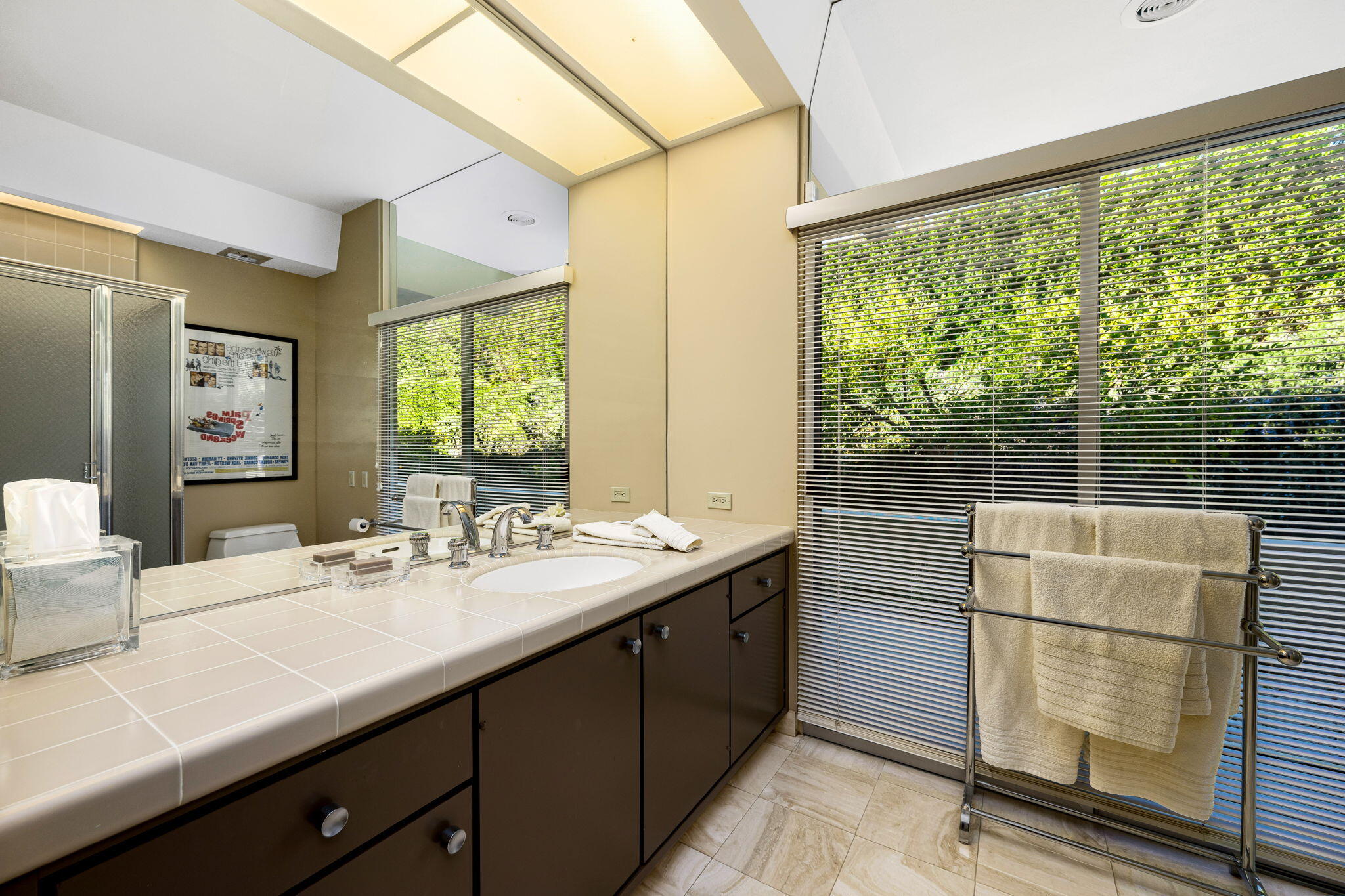 40780 Thunderbird Road Rancho Mirage, CA 92270 - Photo 20 of 29 a bathroom with a double vanity sink and a large mirror