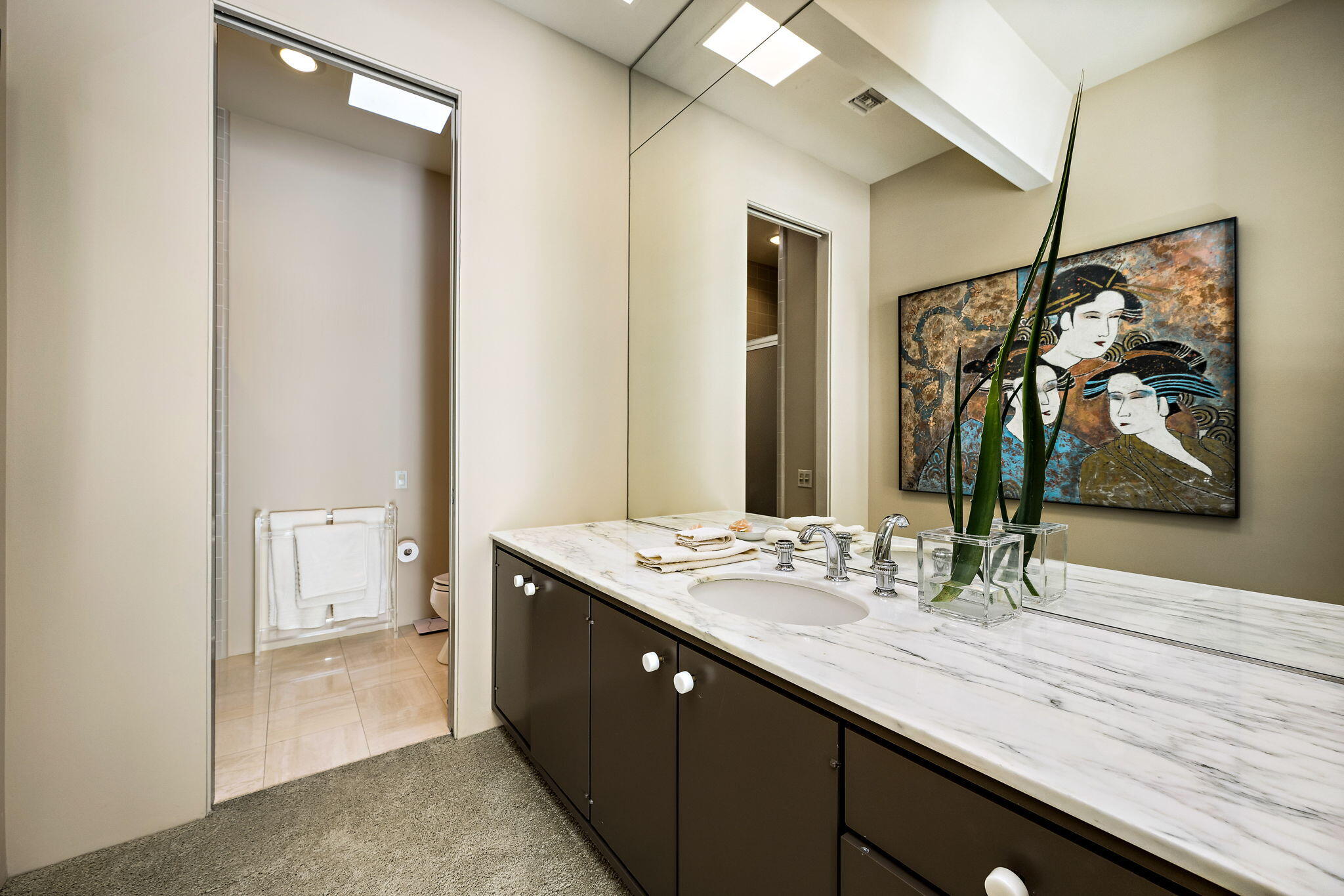 40780 Thunderbird Road Rancho Mirage, CA 92270 - Photo 22 of 29 a bathroom with a sink a vanity and a mirror