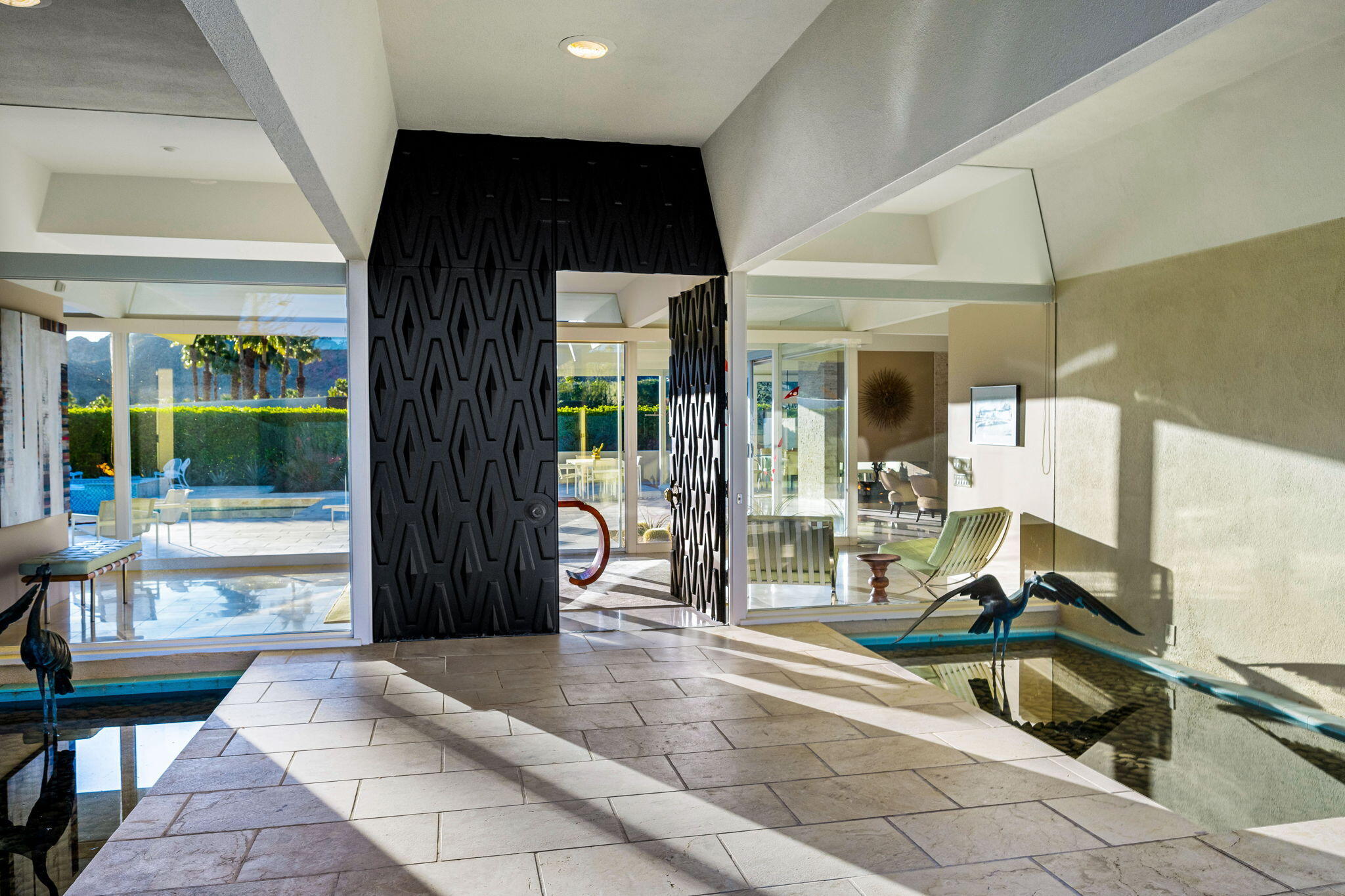 40780 Thunderbird Road Rancho Mirage, CA 92270 - Photo 5 of 29 a living room with furniture and a floor to ceiling window