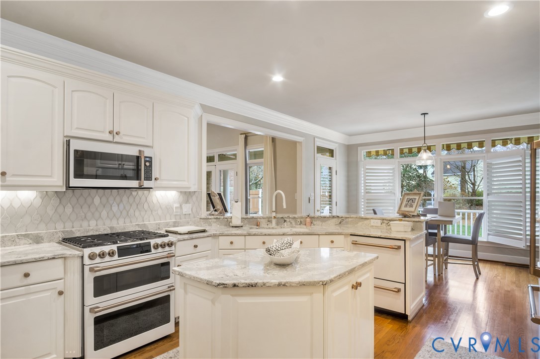 2509 Nathaniell Powell Road Williamsburg, VA 23185 - Photo 15 of 53 a kitchen with stainless steel appliances granite countertop a stove a sink and a microwave