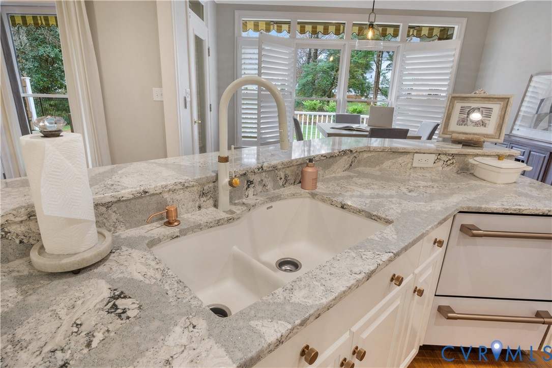 2509 Nathaniell Powell Road Williamsburg, VA 23185 - Photo 18 of 53 a bathroom with a granite countertop sink and a window
