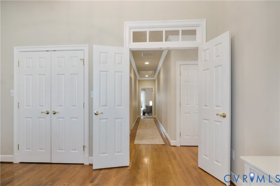 2509 Nathaniell Powell Road Williamsburg, VA 23185 - Photo 22 of 53 a view of a hallway with wooden floor and closet