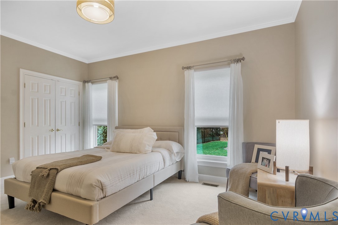 2509 Nathaniell Powell Road Williamsburg, VA 23185 - Photo 23 of 53 a bedroom with a bed and a window