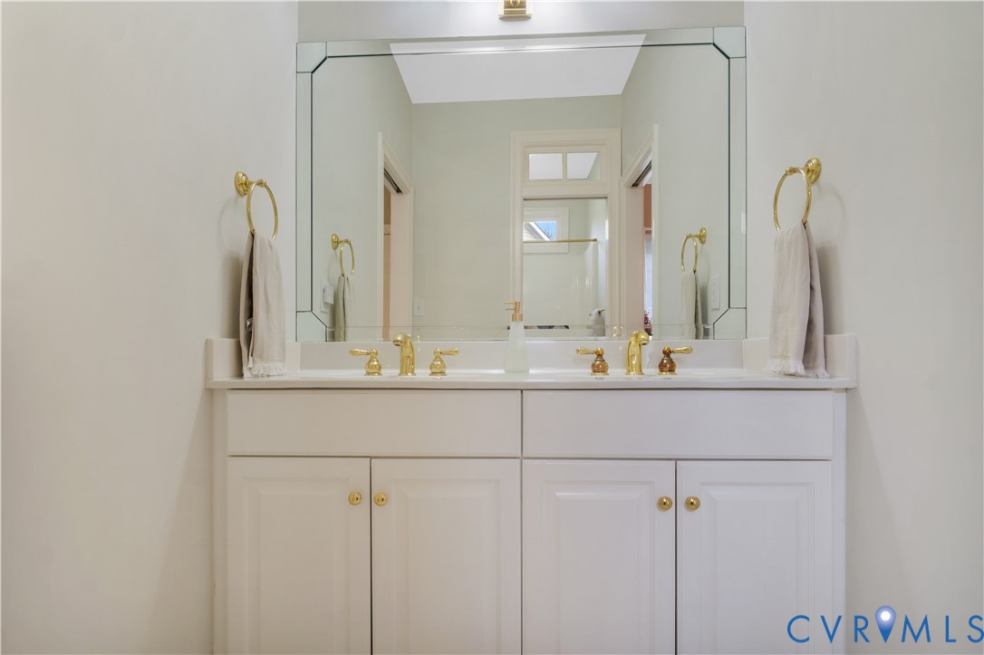 2509 Nathaniell Powell Road Williamsburg, VA 23185 - Photo 26 of 53 a bathroom with a sink and a mirror