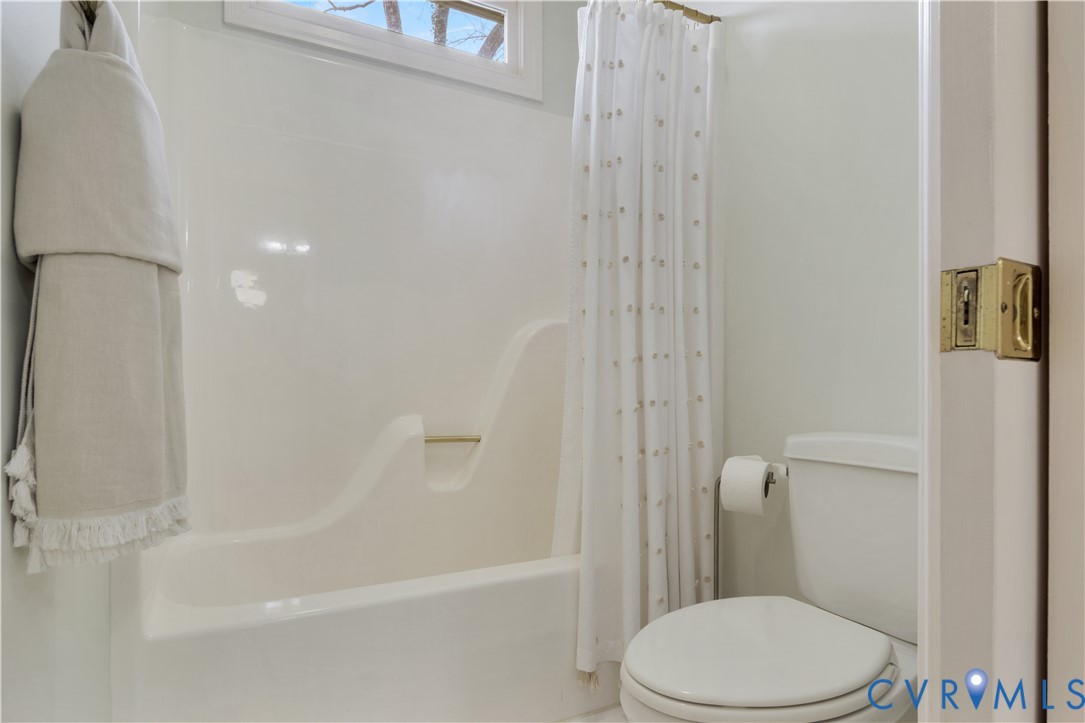 2509 Nathaniell Powell Road Williamsburg, VA 23185 - Photo 27 of 53 a white toilet sitting next to a bath tub