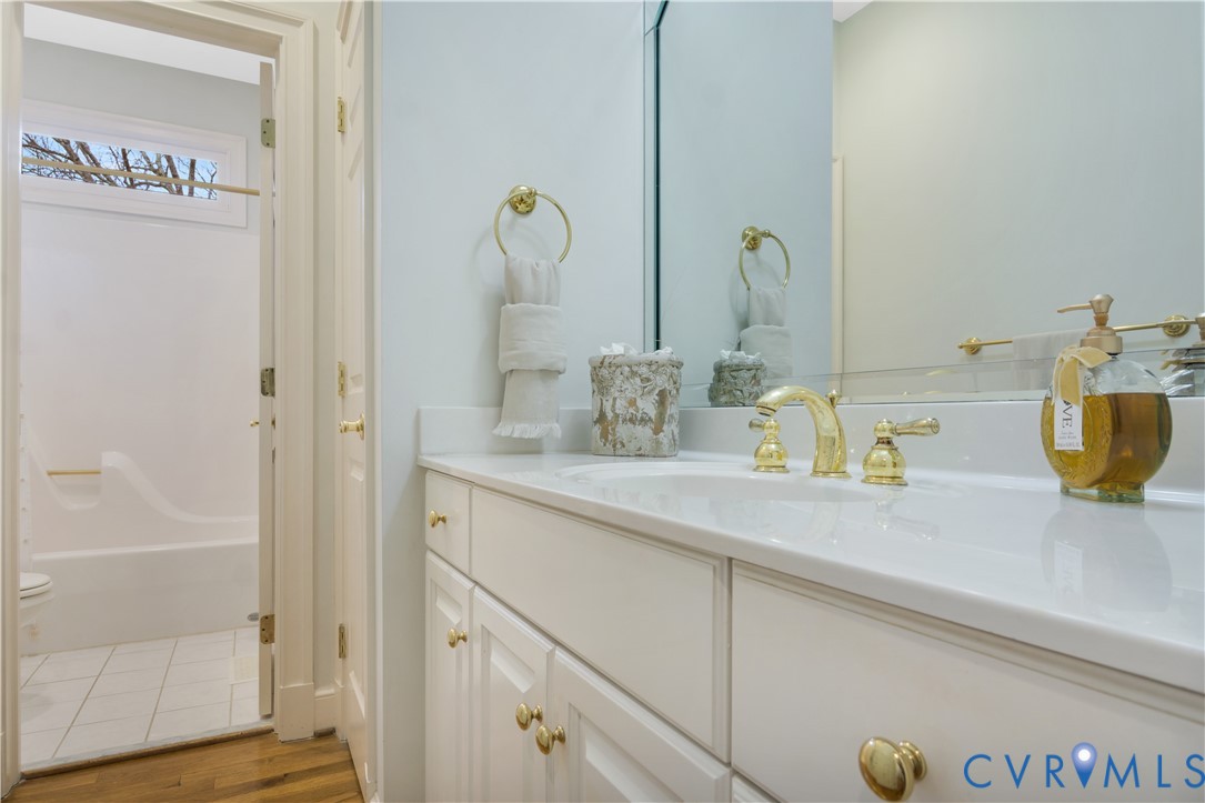 2509 Nathaniell Powell Road Williamsburg, VA 23185 - Photo 31 of 53 a bathroom with a sink a mirror and shower