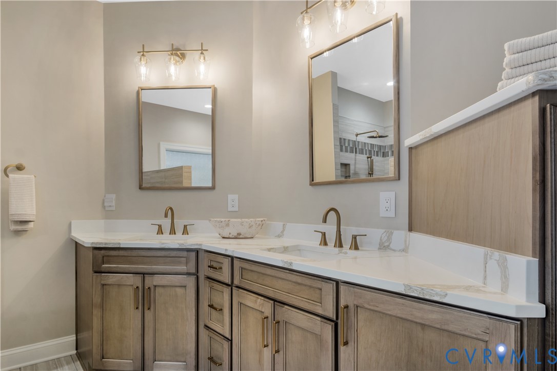 2509 Nathaniell Powell Road Williamsburg, VA 23185 - Photo 36 of 53 a bathroom with a sink and a mirror