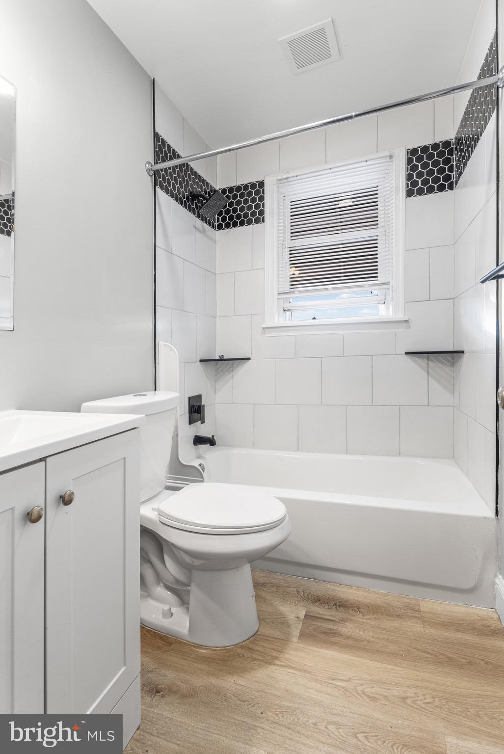 2203 Redthorn Road Baltimore, MD 21220 - Photo 10 of 23 a bathroom with a sink a toilet and bathtub