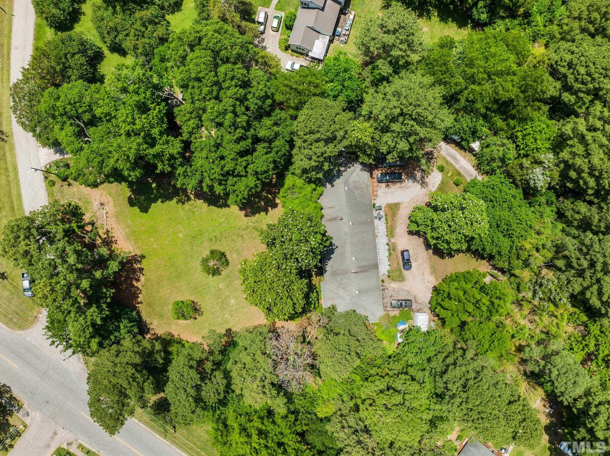 125 King William Road Raleigh, NC 27610 - Photo 3 of 33 an aerial view of a house with a yard