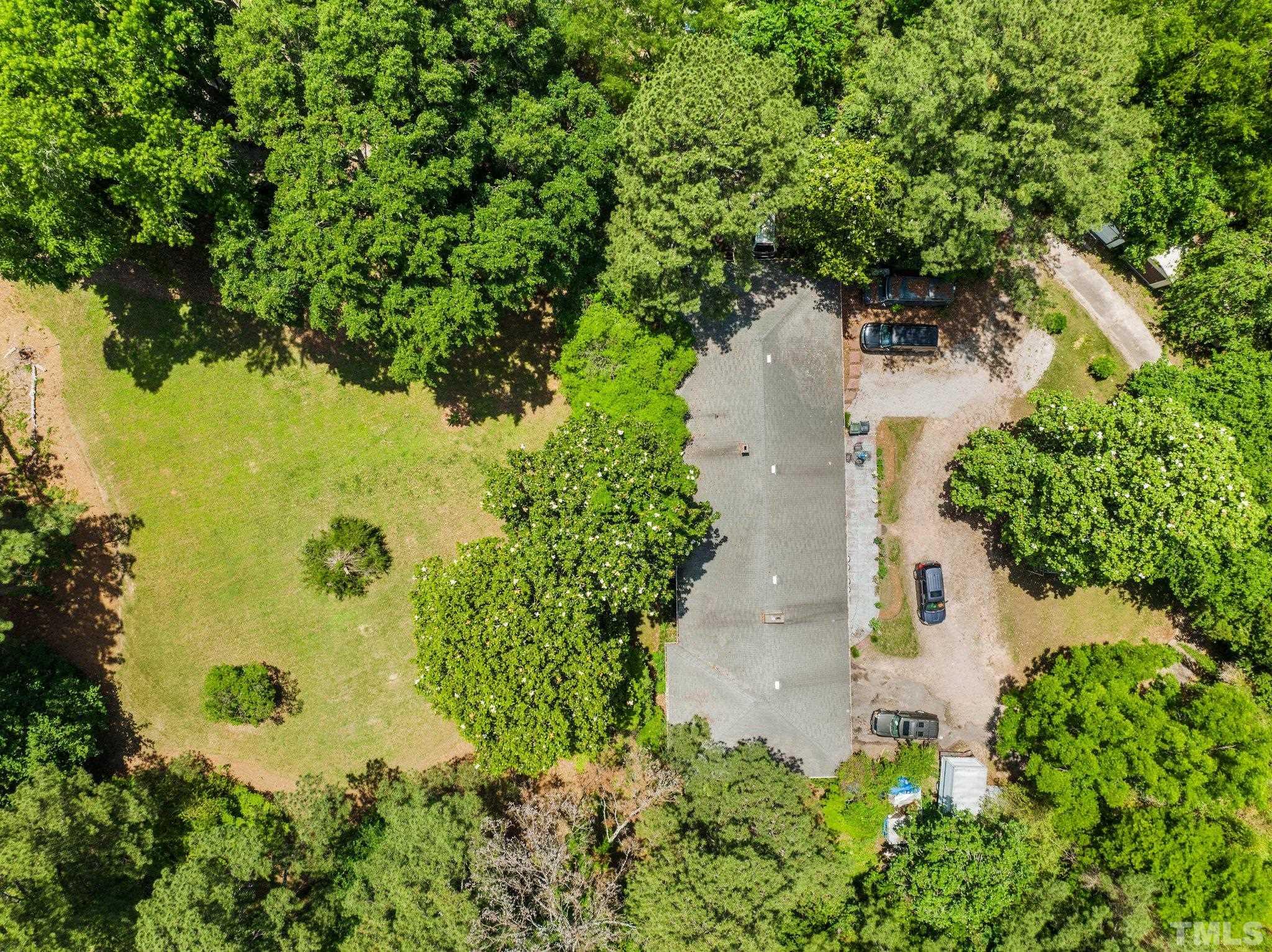 125 King William Road Raleigh, NC 27610 - Photo 7 of 33 an aerial view of a house with yard