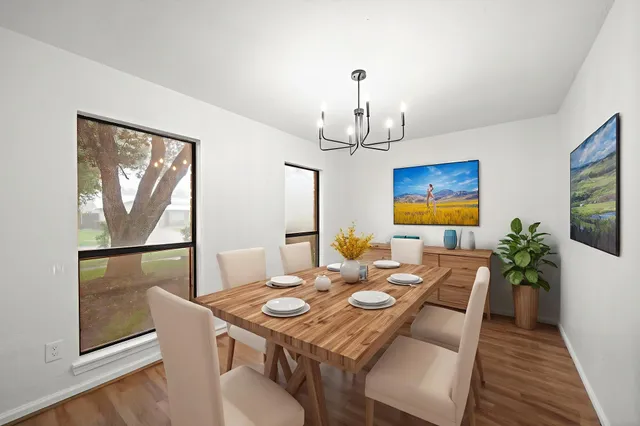 a view of a dining room with furniture window and wooden floor