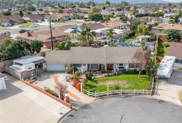 an aerial view of a house with a garden space