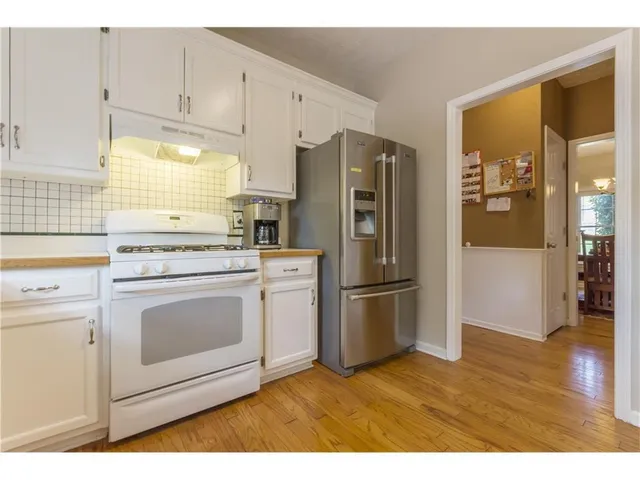 a living room with furniture potted plant and a window