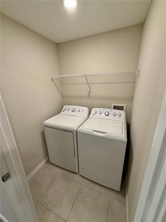 11826 Dumaine Valley Road Riverview, FL 33579 - Photo 30 of 54 a utility room with dryer and washer