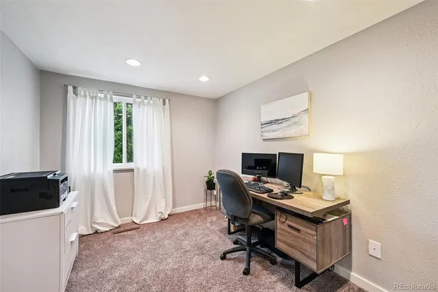 a workspace with furniture and window