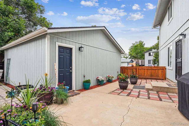 a view of a backyard with a patio