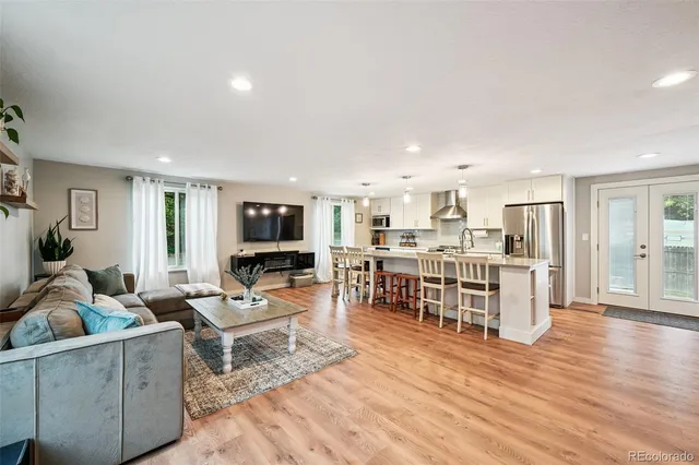 a living room with furniture and flat screen tv