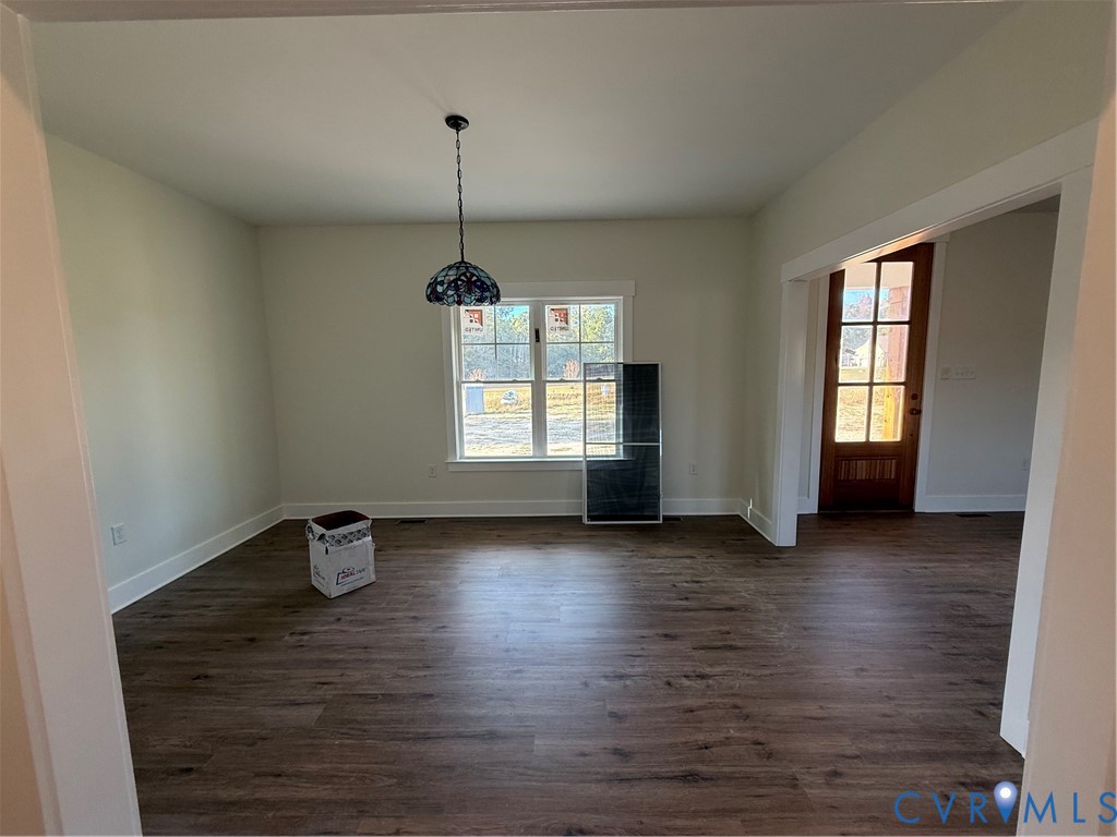 2 A Webb Road Disputanta, VA 23842 - Photo 13 of 29 a view of an empty room with window and hardwood floor