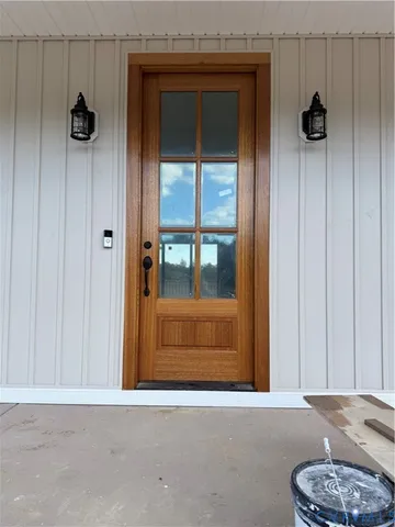 a view of a room with a furniture and a window