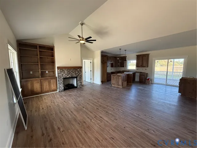 a view of a livingroom with furniture and a fireplace