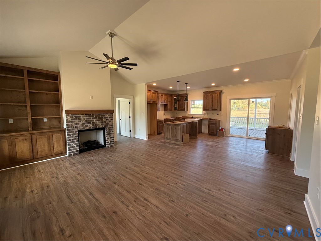 2 A Webb Road Disputanta, VA 23842 - Photo 8 of 29 a view of a livingroom with furniture a fireplace and wooden floor
