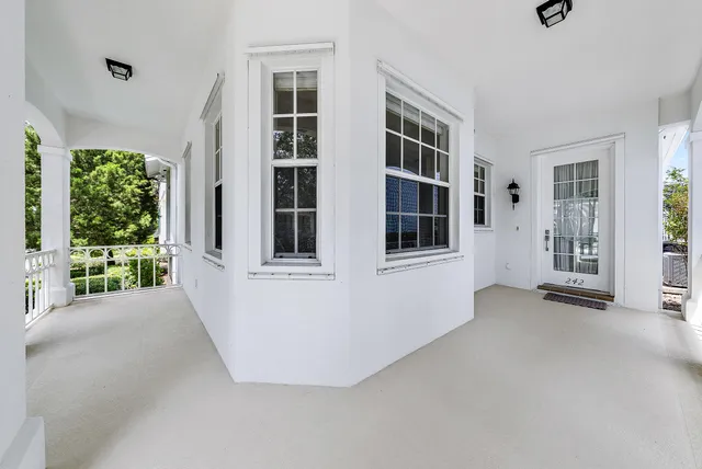 a view of an empty room with windows