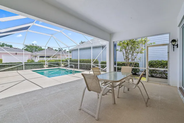 a patio with yard table and chairs