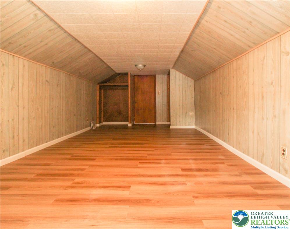 492 Filetown Road Nazareth, PA 18064 - Photo 23 of 30 A spacious attic space with warm wooden paneling and durable flooring, offering versatile potential.