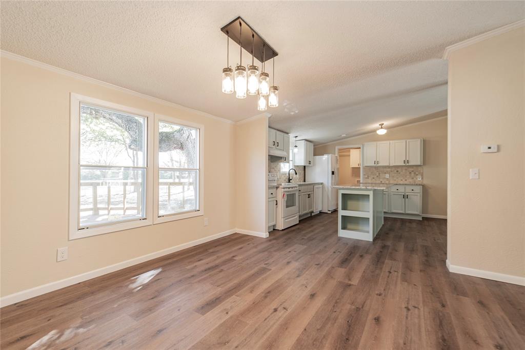 667 Rs County Road 1503 Point, TX 75472 - Photo 15 of 38 a view of a kitchen with wooden floor and a window