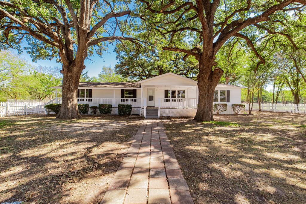 667 Rs County Road 1503 Point, TX 75472 - Photo 2 of 38 a tree in front of a white house